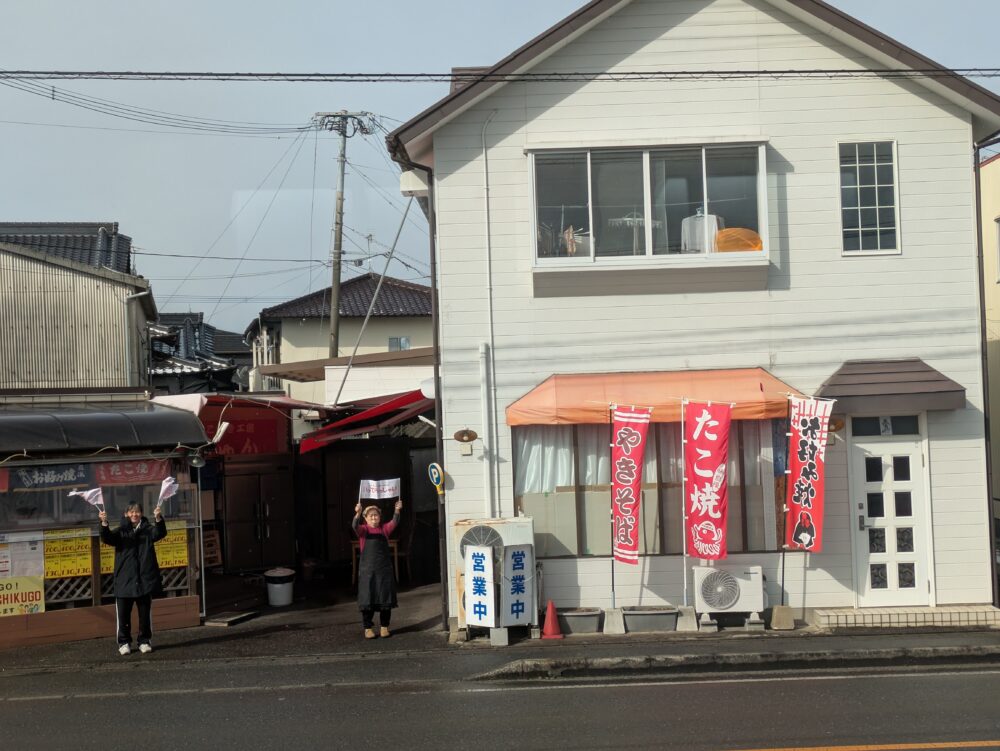 たこ焼き店のお見送り