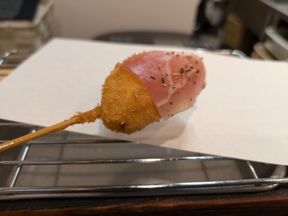 冨来也のニンニクの芽と生ベーコン